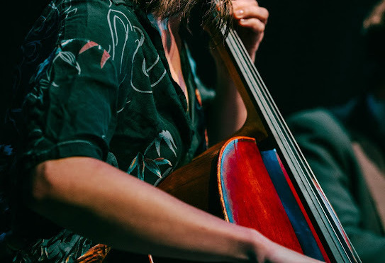 Close-up of Hannah Paulus playing cello in performance